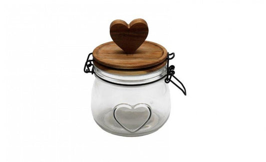 A small glass jar with a wooden lid and a heart-shaped cut-out on the lid, resembling a heart shape.