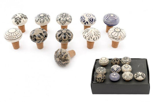 decorative bottle stopper with various patterns on a white background